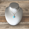 Pendants, Opal Reverses to Zia Symbol Round in Sterling - Gloria Sawin  Fine Jewelry 